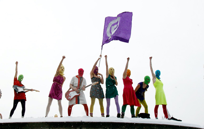 Members of the Russian radical feminist group 'Pussy Riot' stage a protest performance in Red Square in Moscow