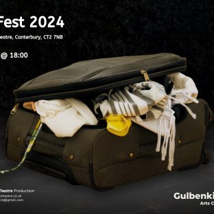 a suitcase against a black background with clothes spilling out of it.