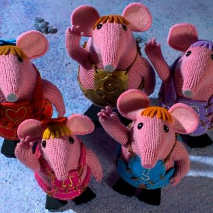 5 pink mice puppets waving up at the camera